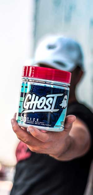 man holding tub of ghost size