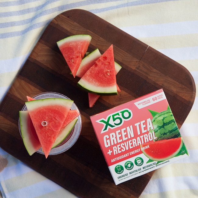 X50 box next to fresh watermelon