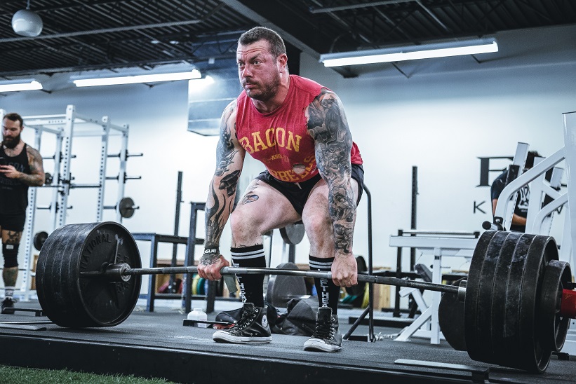 a man deadlifting