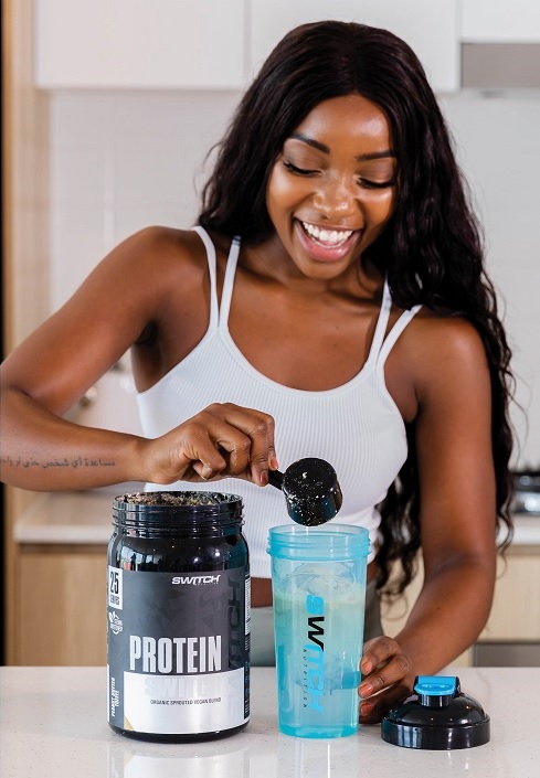 girl mixing a drink of protein switch