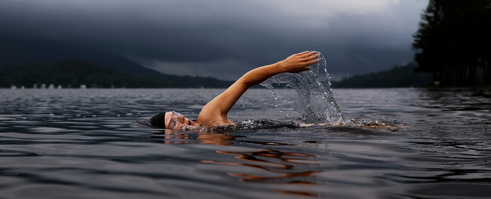 a man swimming outdoors