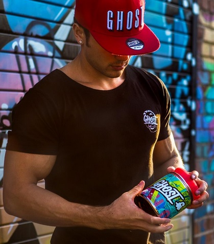 man holding ghost amino 